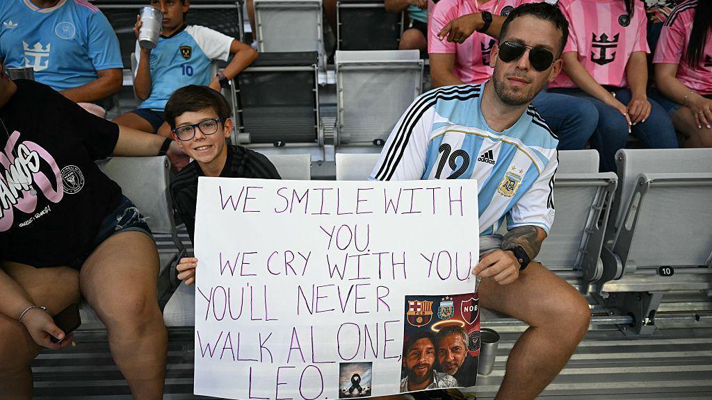 Inter Miami fans display a homemade sign
